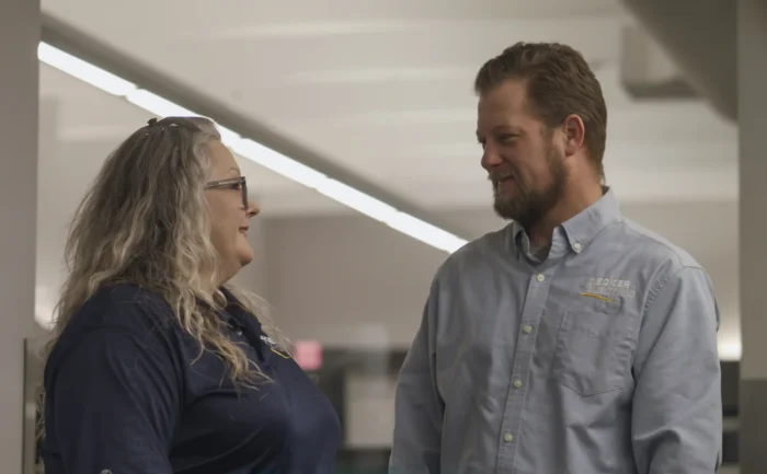 Decker Electric team members talking in the office